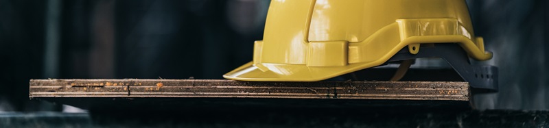 engineer and construction ideas concept with yellow helmet equipment tools at construction site