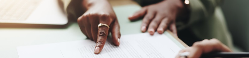 Business people, hands and pointing on contract for legal documents, application and agreement in office