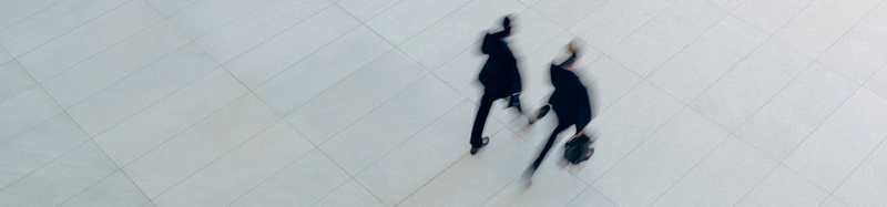 Two people walking in forward motion