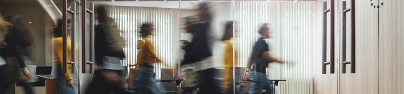 Businesspeople walking at modern office