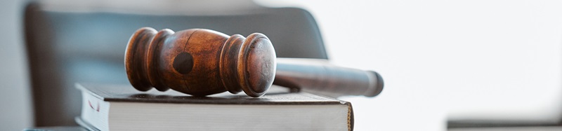 Justice, gavel and law books on table in office for court trial, legislation or fair constitution by judicial system