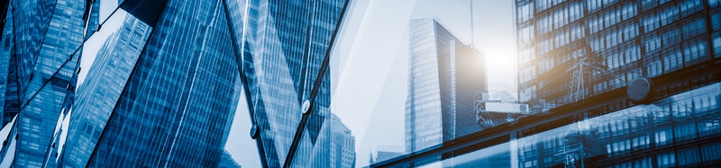 Search by image or video View of a modern glass skyscraper reflecting the buildings around stock photo