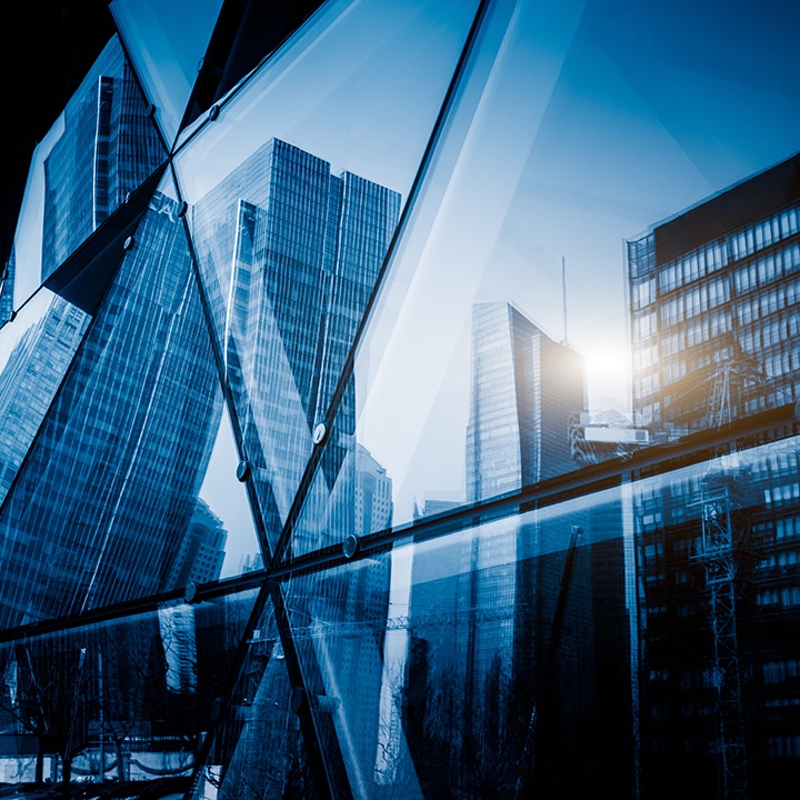 Search by image or video View of a modern glass skyscraper reflecting the buildings around stock photo